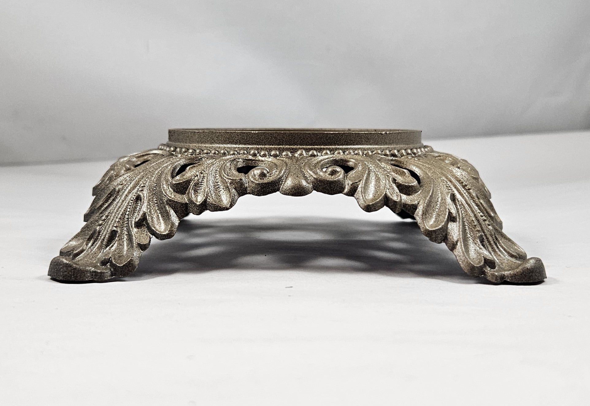 cast metal base in antique brass finish - insert top 3-1/4", Ht. 1-5/8", Bottom Spread 7-1/2"