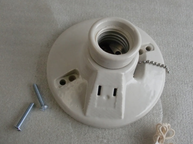 Porcelain Lamp Holder featuring pull chain and plug.