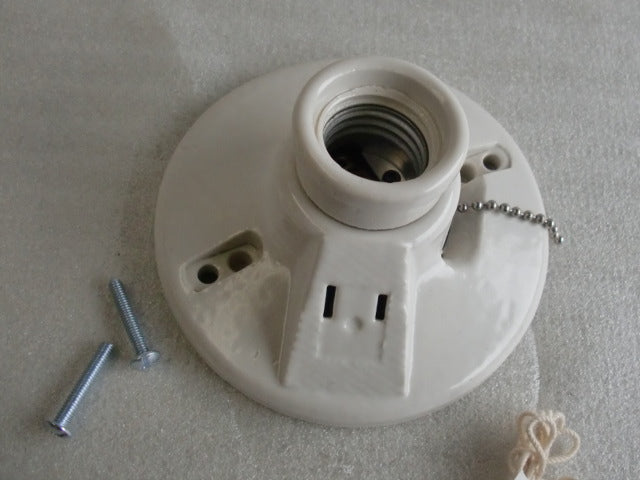 Porcelain Lamp Holder featuring pull chain and plug.