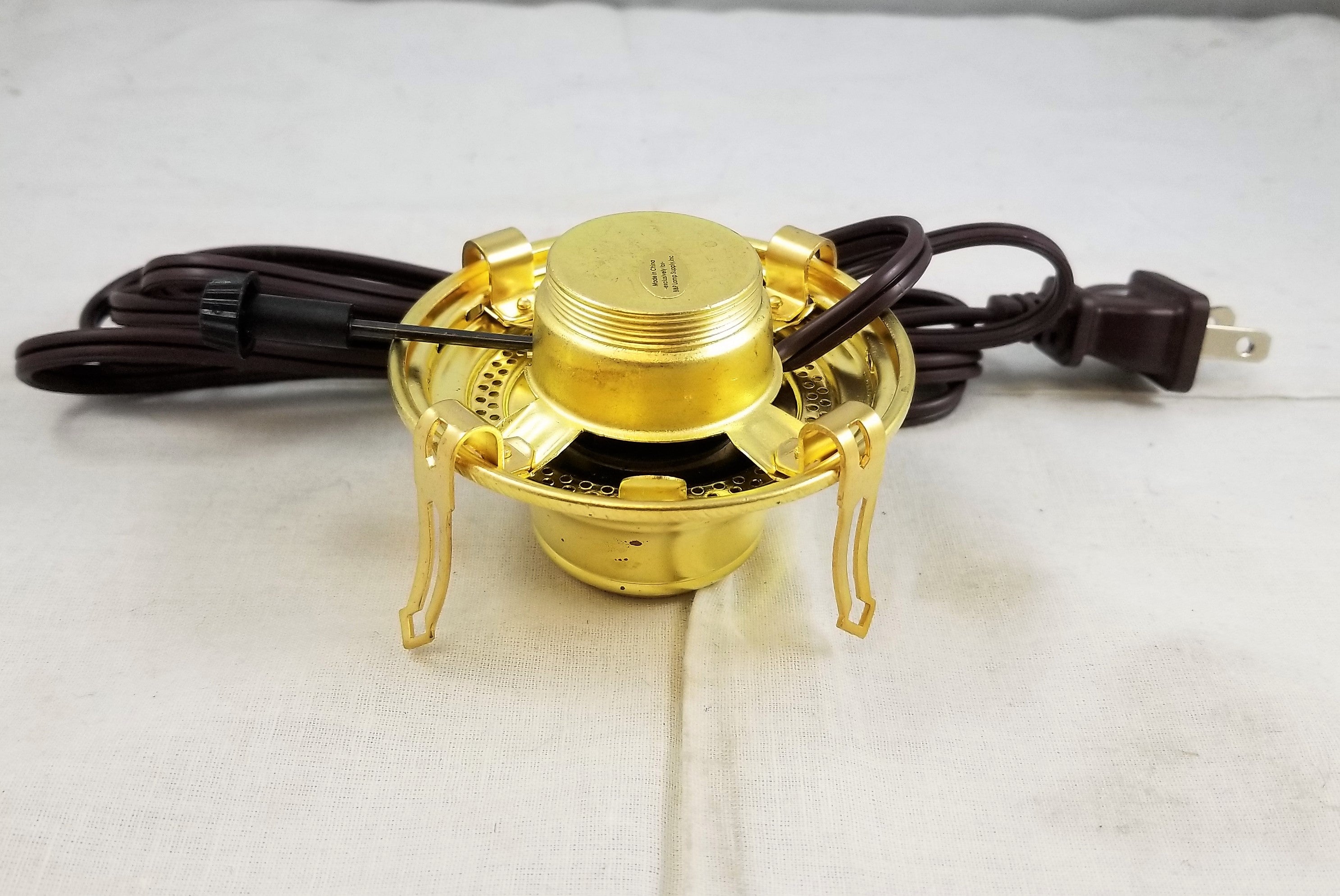 Queen Anne solid brass wired burner with brown cord.