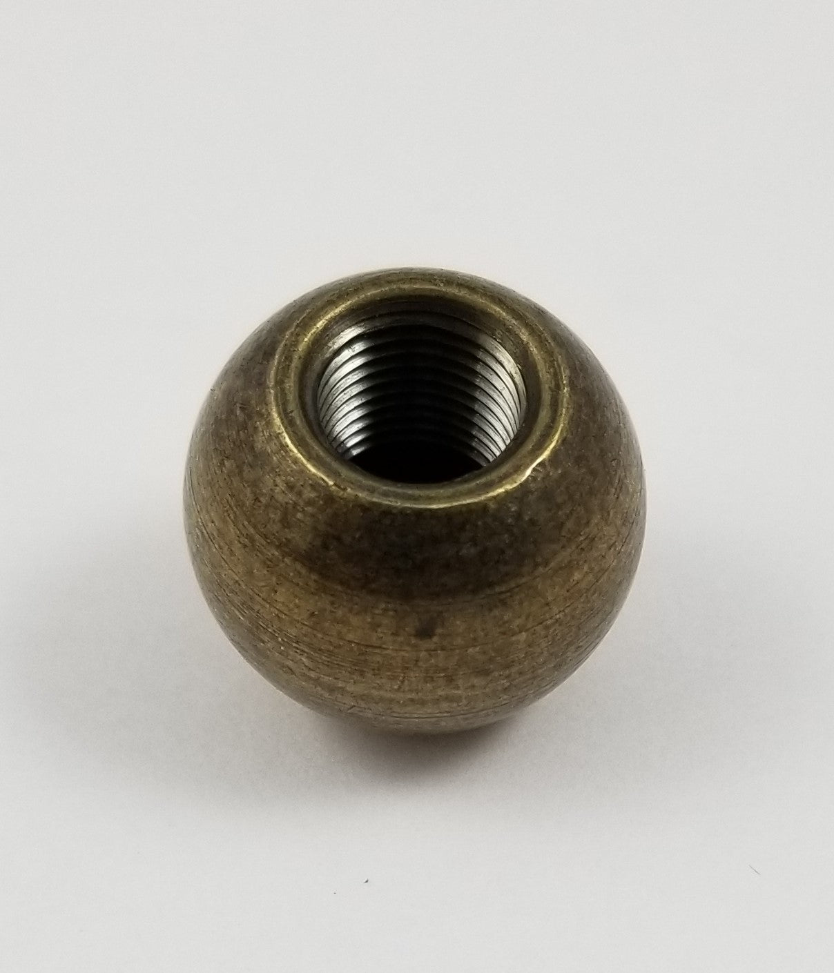 3/8" threaded brass ball ornament in antique brass.