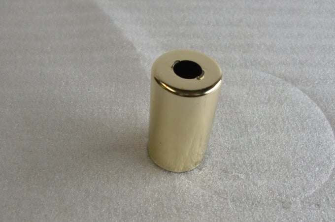 Shiny brass socket cover 1.75 inches tall.