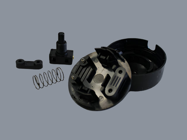 Electrical step-on switch (shown unassembled) in Black.
