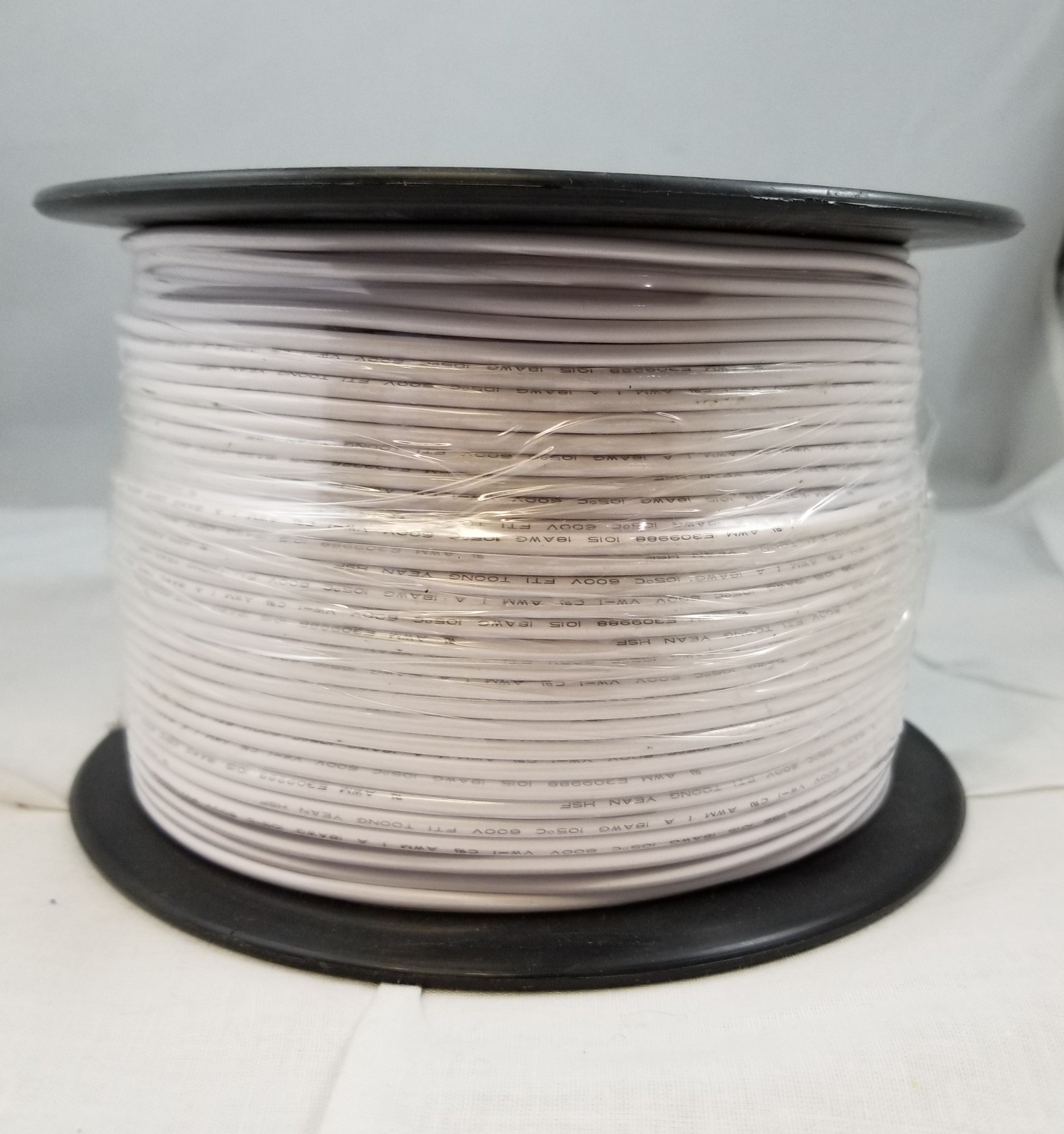 Foot of Single Plastic Covered White Fixture Wire
