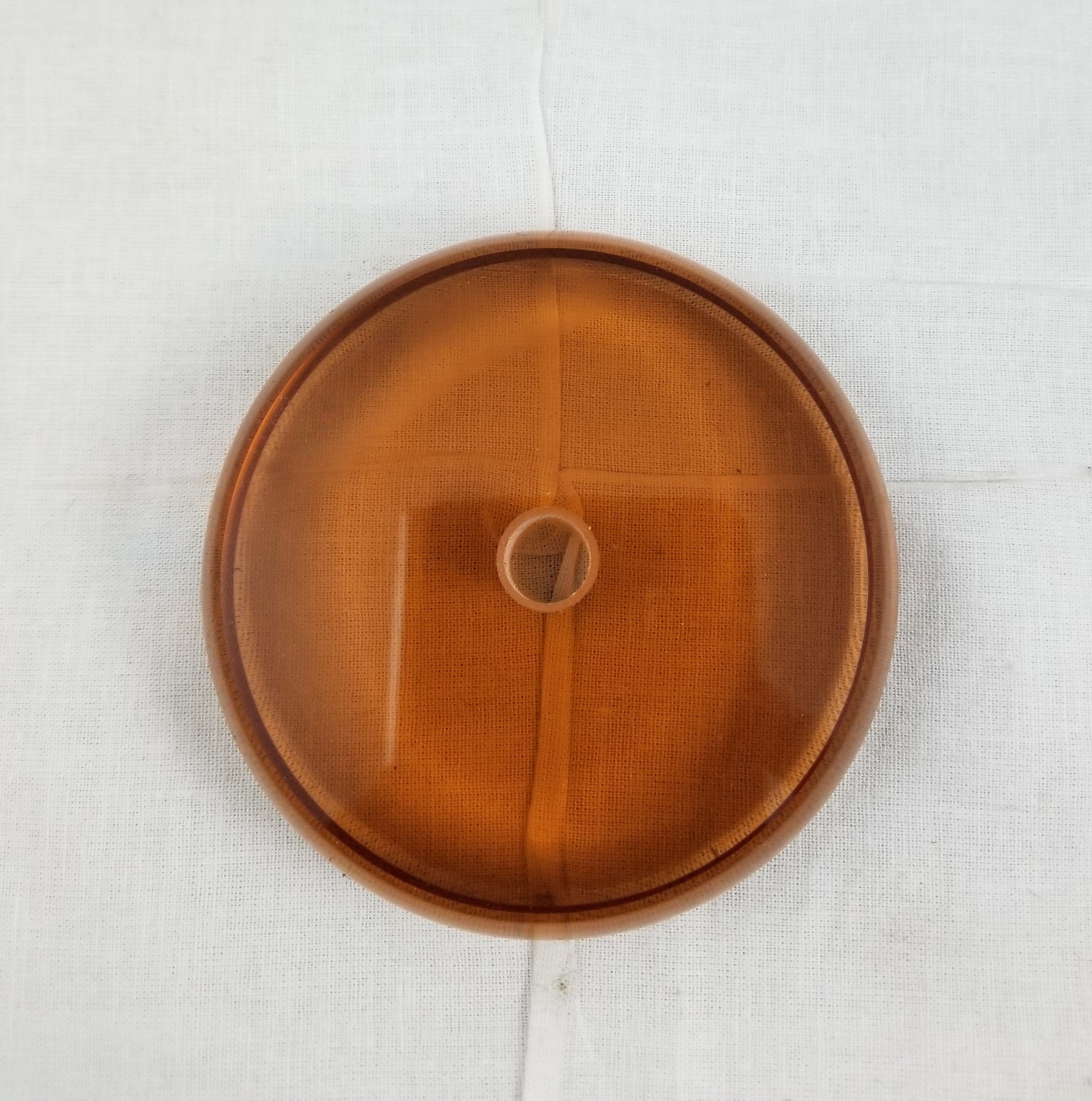 3-1/2" dia. Amber glass ring or break, ht. 1/2", 7/16" hole