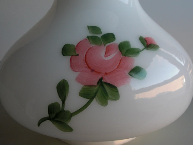 Light red floral design on shiny opal backing.